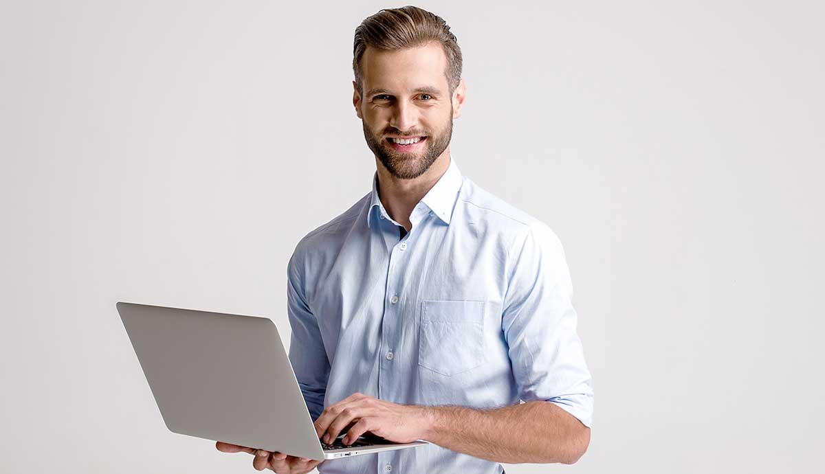 Smiling Man with Laptop